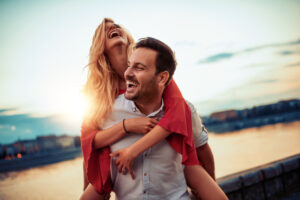 Happy young couple having fun outdoors.
